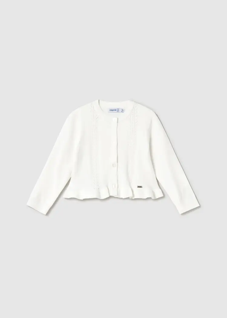 Cardigan in maglia con volant in vita. Chiusura con bottoncini.