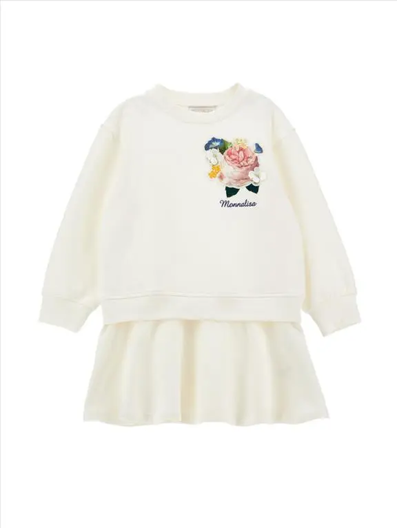 Vestito in felpa da bambina decorato con toppe a fiori.